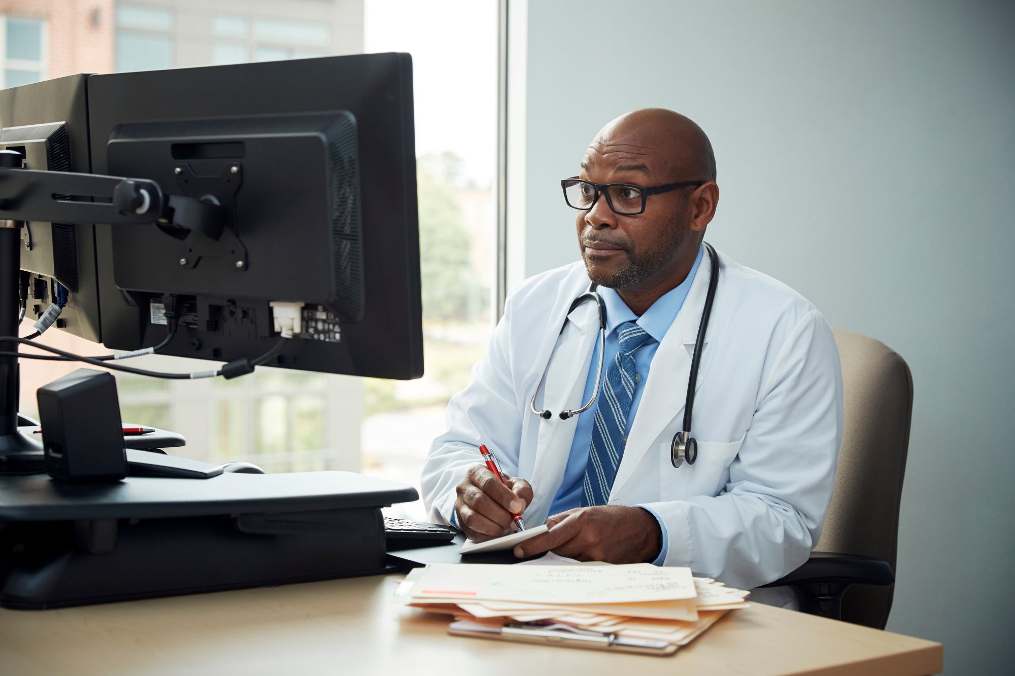Doctor looking at computer